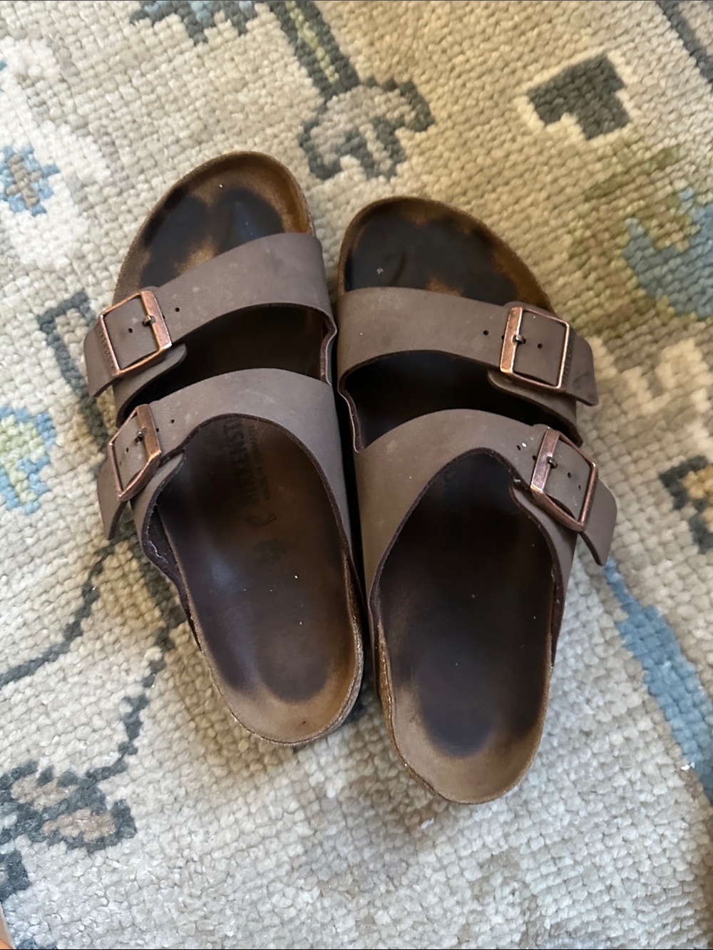 Well lived Birkenstock Men's Two-Strap Slides in Dark Brown with Copper Buckles